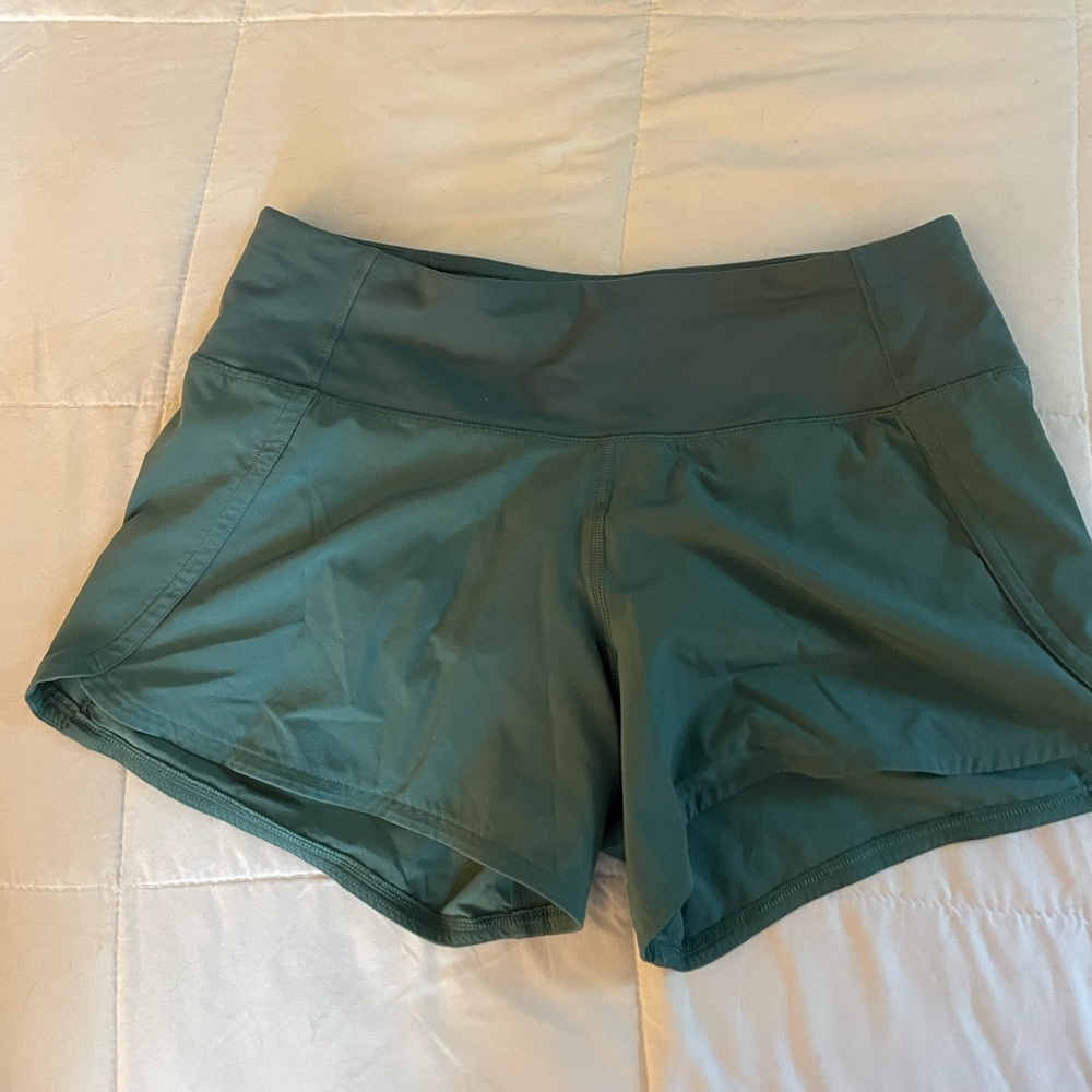 Lululemon Shorts, old version of speed ups, size 4 but could fit a 2, dark green